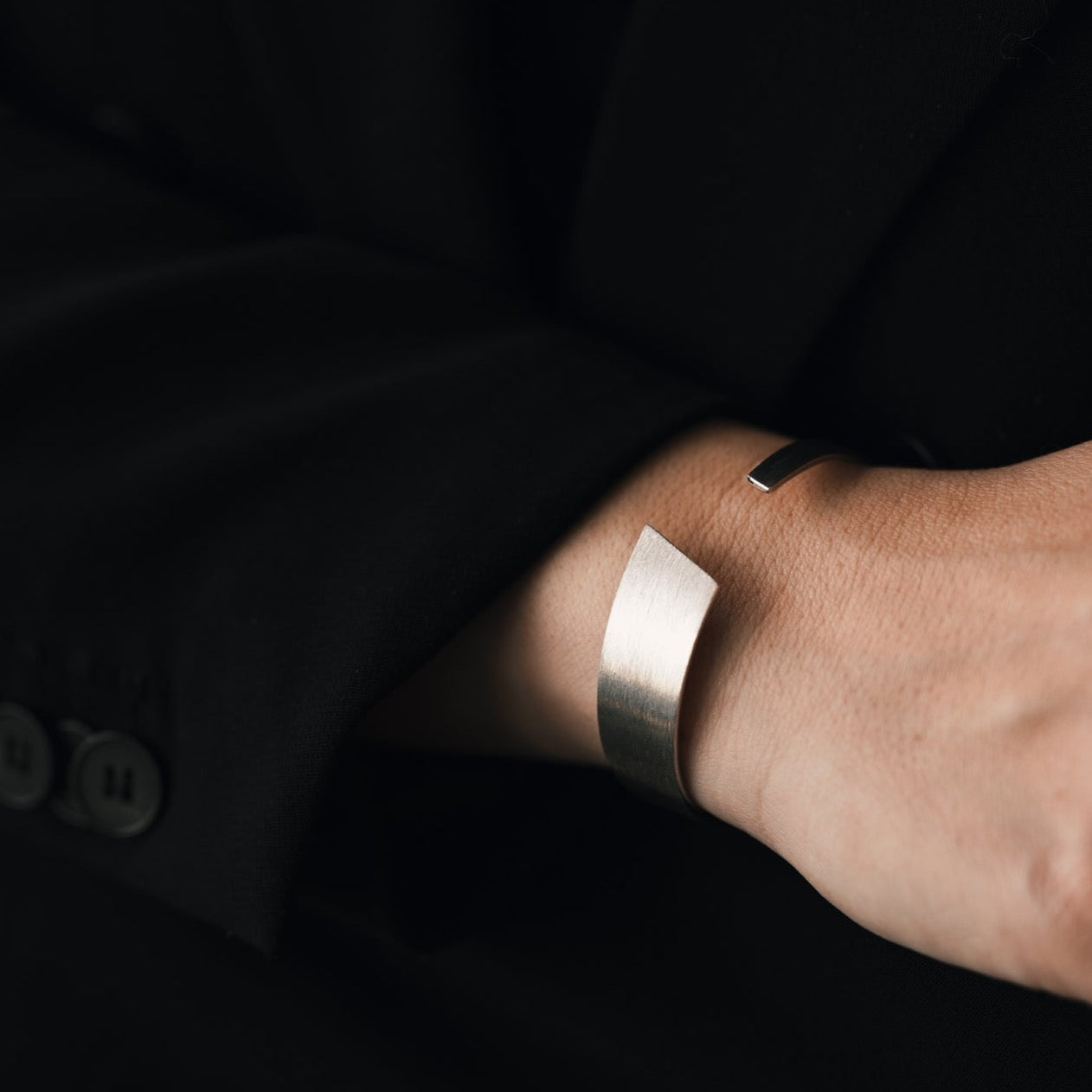 Silver bangle with a brushed surface