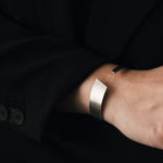 Silver bangle with a brushed surface